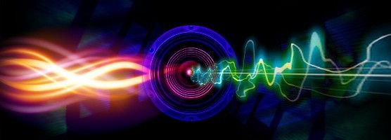 Image of orange and pink waves flowing through a speaker face and flowing out the other side as a green sound wave. Flavorlab is offering free sound effects.