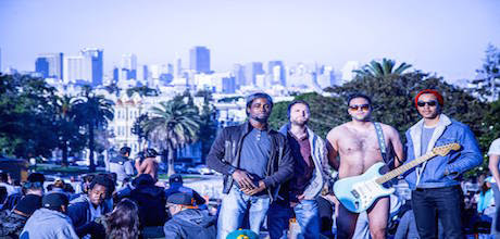 Picture of band, Vinyl Spectrum, standing in front of the Los Angeles skyline. Vinyl Spectrum is a producer for the Producer's Toolbox.