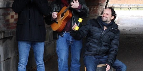 Still of Matt Block, Erik Blicker, and Glenn Schloss playing trumpet, guitar, and cajon in a Happy New Year message from the Flavorlab team!