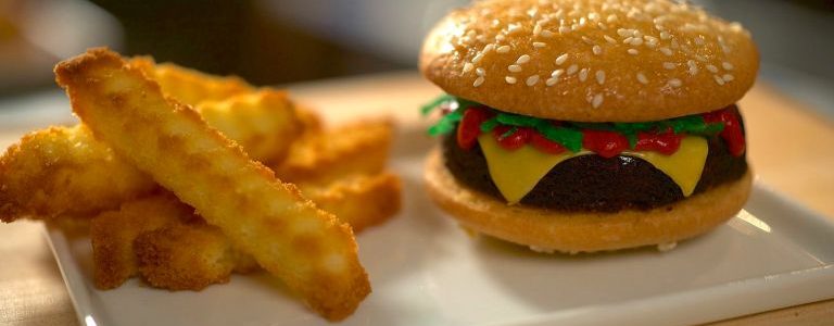 Still from Reality Cupcakes of what looks like a cheeseburger and french fries, but is actually cupcakes. Flavorlab Sound provide sound design and mix for the pilot season of the show.