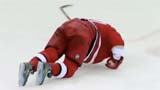Photo of a hockey player in a red uniform, falling into the ice. Flavorlab Score composers Erik Blicker and Glenn Schloss wrote custom music for the 2018 NHL season.