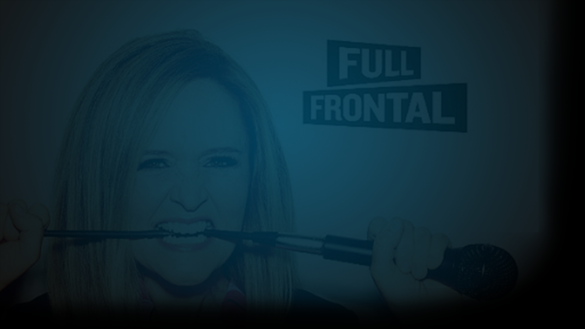 Still of Samanatha Bee biting the cord of a microphone as she looks into the camera. The words Full Frontal are next to her head. Flavorlab Score provided original music to the show with song "Working Man."