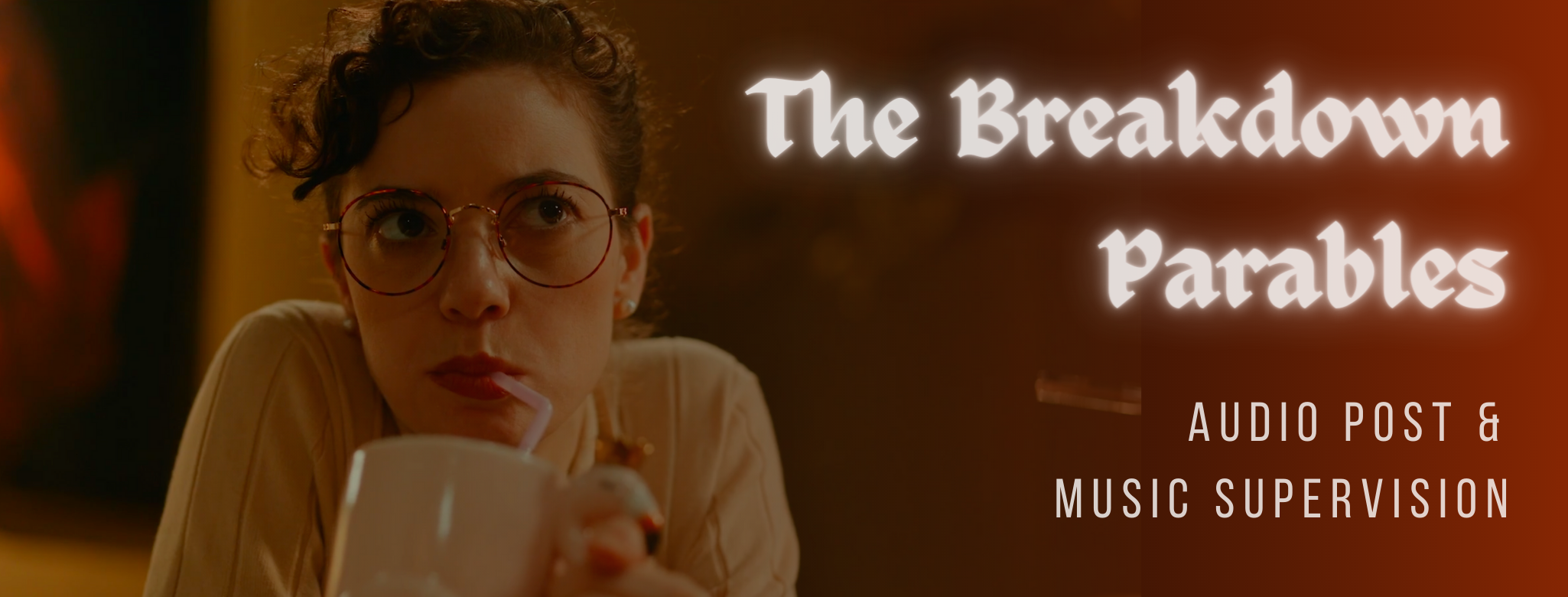 Still from the short film, The Breakdown Parables, directed by Emil Benjamin of Irrelevant Media. The image features the film's audition room receptionist wearing a white shirt and round glasses sipping out of a mug with a straw and staring annoyed into the existence. Flavorlab Sound provided sound design and mix to the film. Producer's Toolbox provided music supervision for the film.